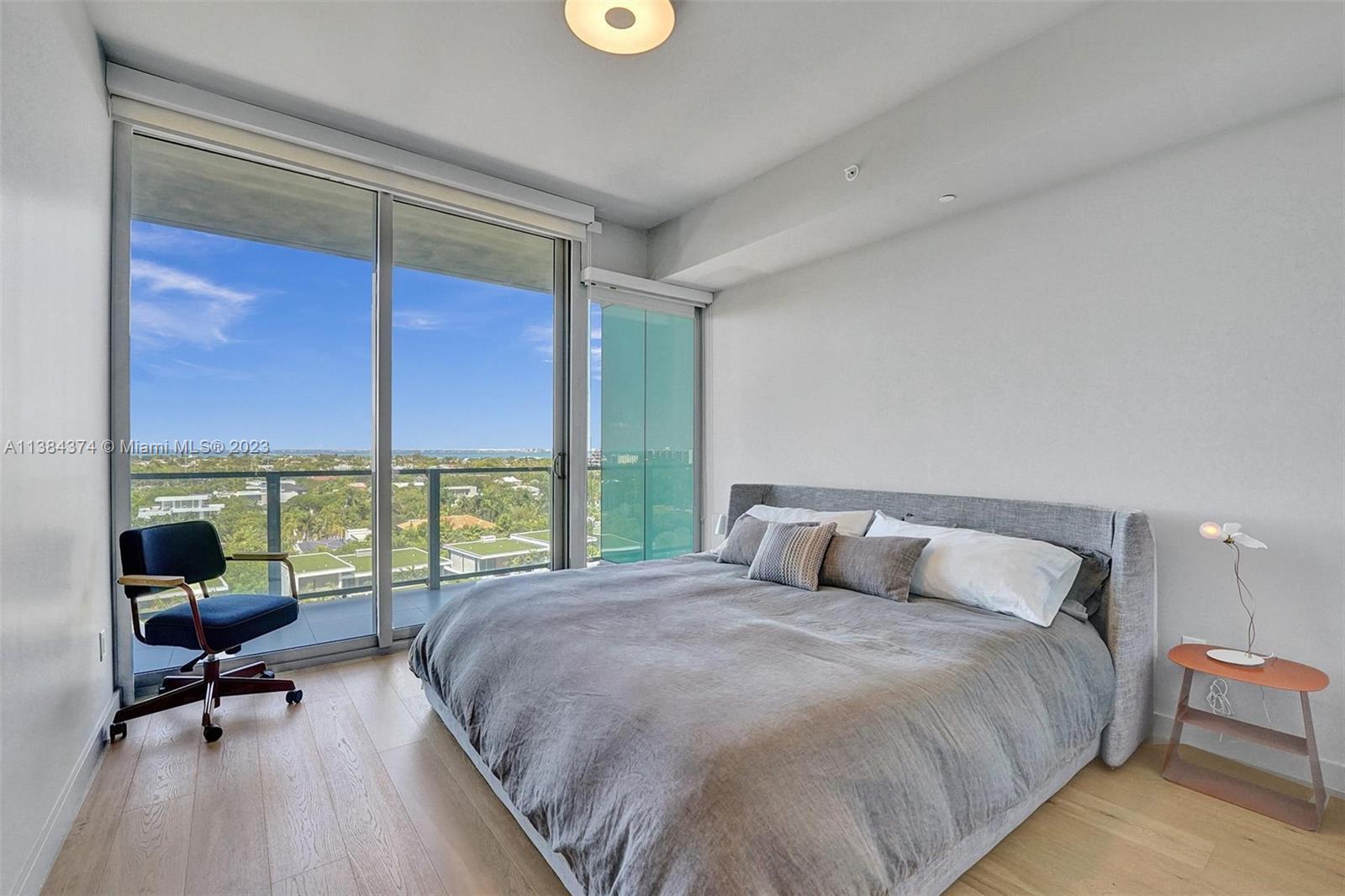 360 Ocean Drive, Unit 906S Key Biscayne, FL 33149 - Photo 18 of 33 a bedroom with a bed and a night stand