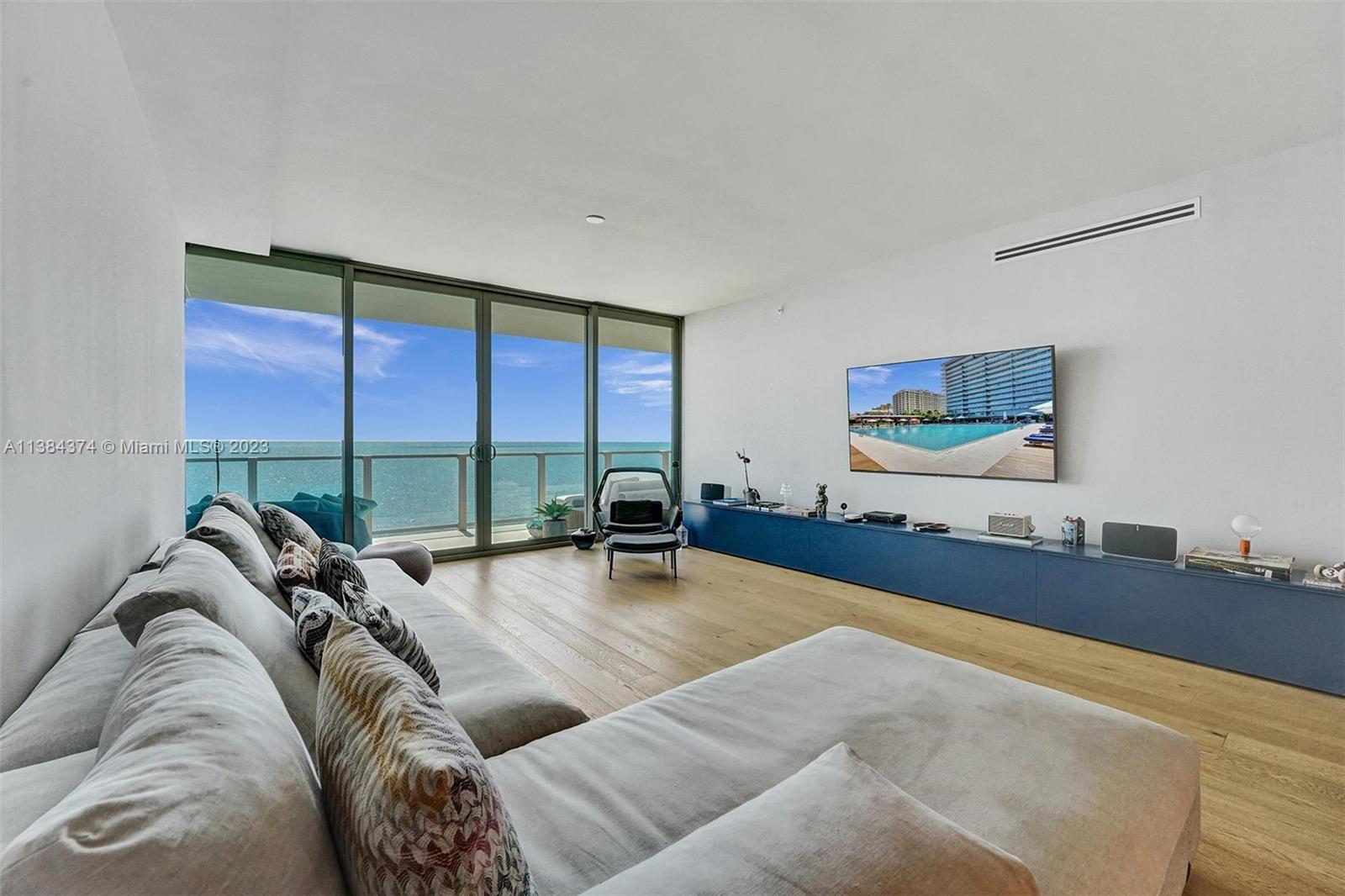 360 Ocean Drive, Unit 906S Key Biscayne, FL 33149 - Photo 27 of 33 a living room with furniture and a large window