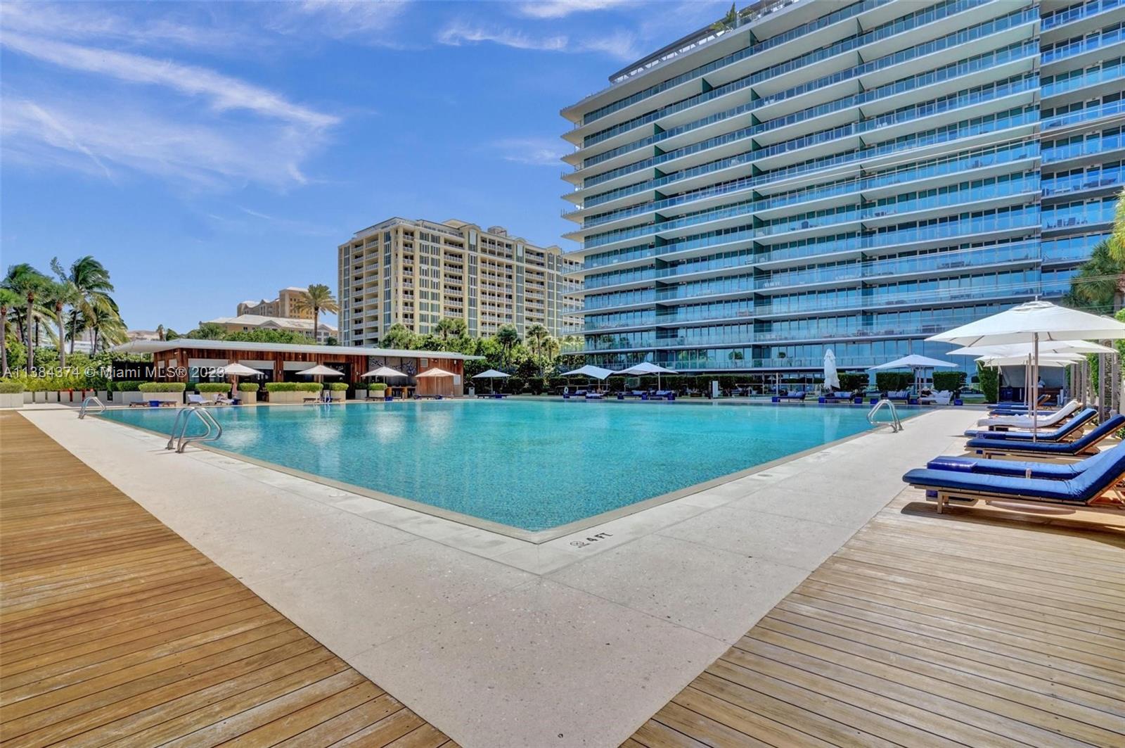 360 Ocean Drive, Unit 906S Key Biscayne, FL 33149 - Photo 29 of 33 a view of swimming pool with outdoor seating and lake view