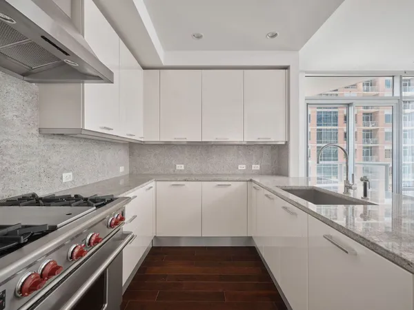 a kitchen with a sink and cabinets