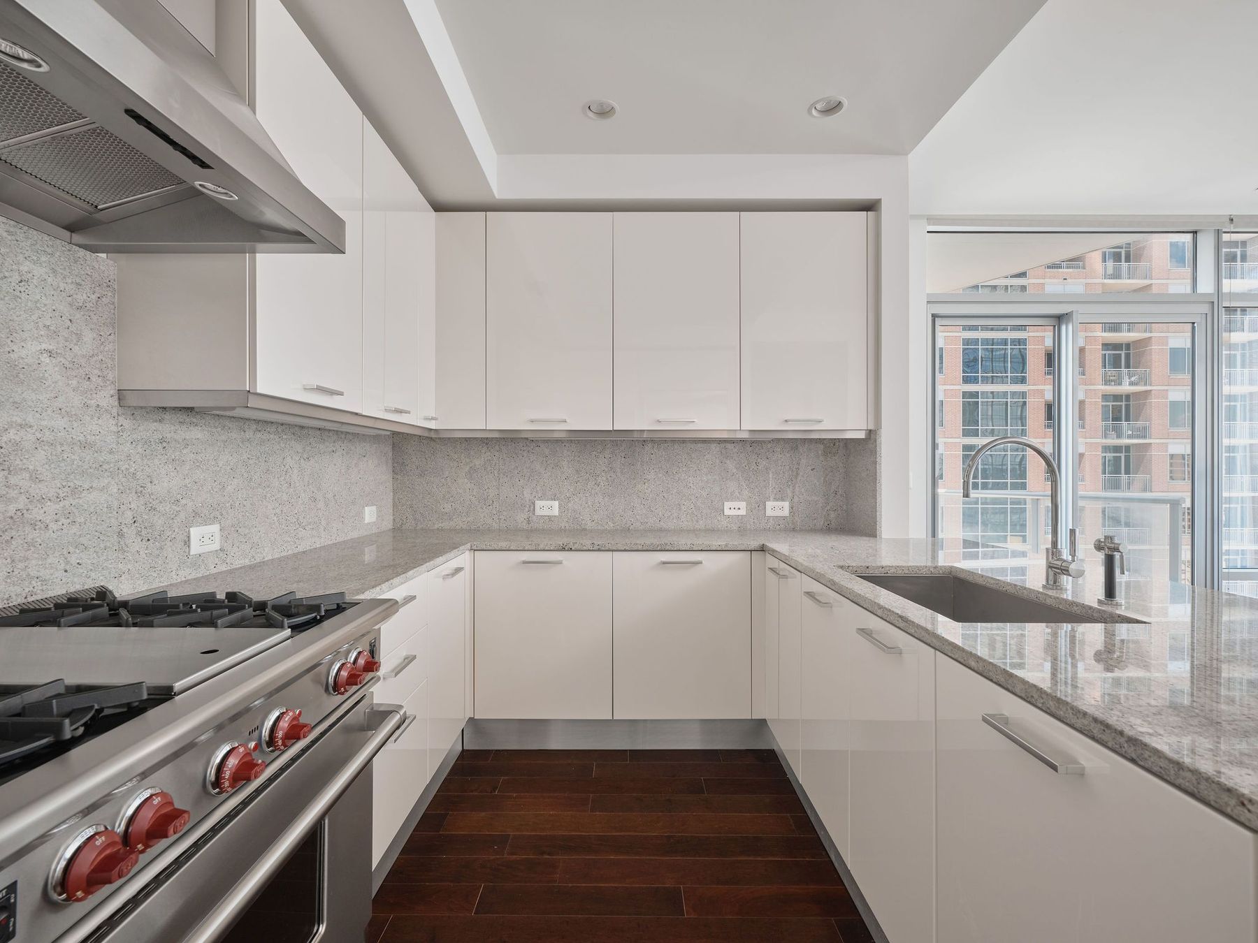 200 Congress Avenue, Unit 23C Austin, TX 78701 - Photo 10 of 40 a kitchen with a sink and cabinets