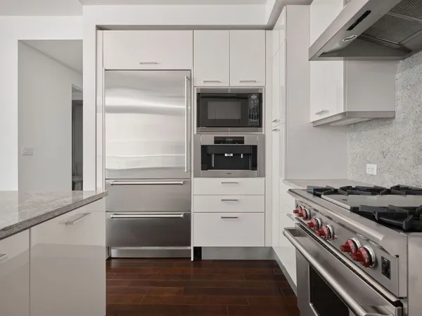 a kitchen with stainless steel appliances a stove and a refrigerator
