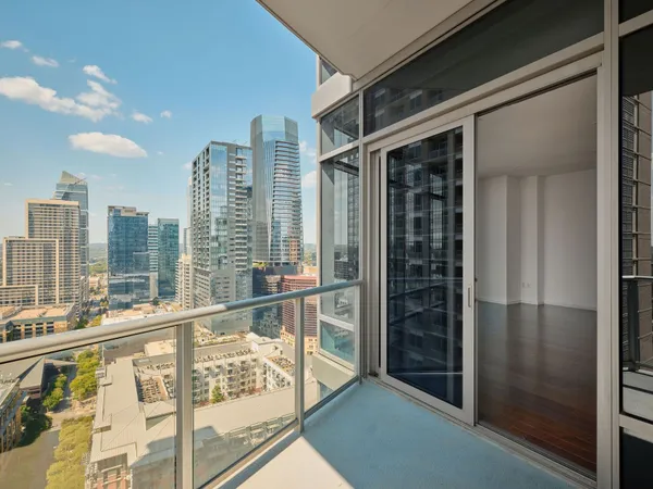 a view of a balcony with city view