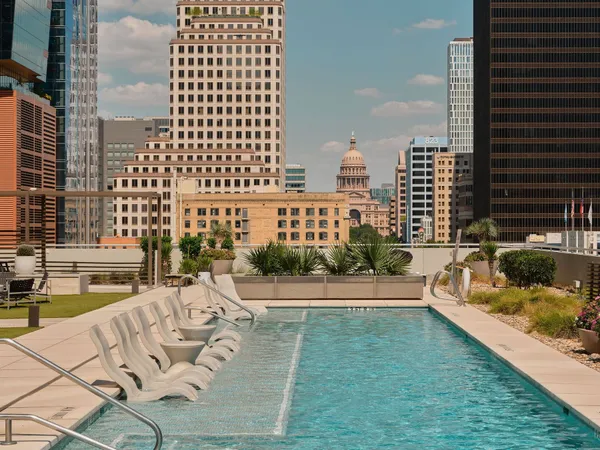 a view of swimming pool with outdoor seating