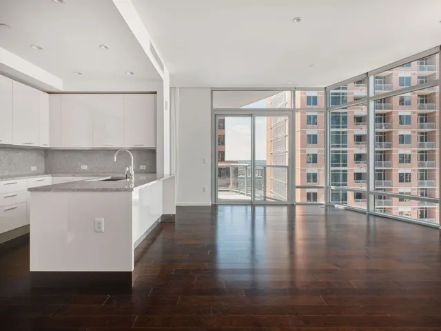 a room with gym equipment and large mirror