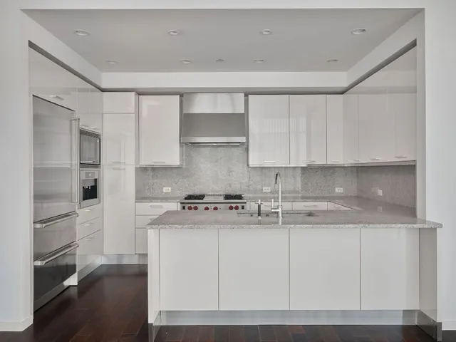 a view of kitchen with furniture and wooden floor