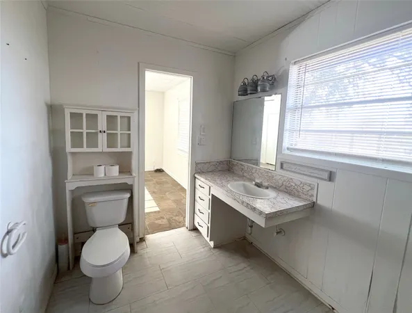 a bathroom with a tub sink a mirror and shower