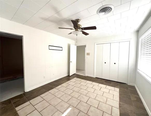 a view of an empty room and window