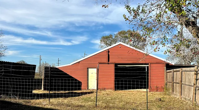 a view of an empty room with windows