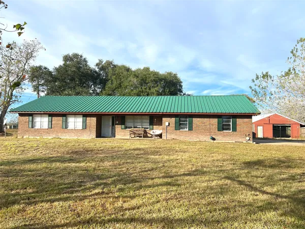 a house with trees in front of it