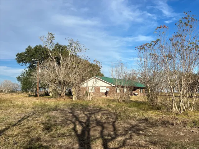 a view of a lake with a yard