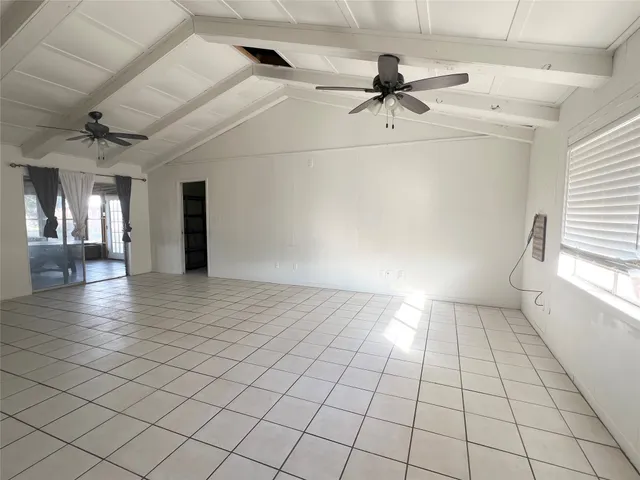 a view of an empty room and window