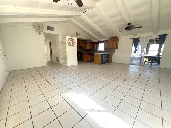 a kitchen with stainless steel appliances granite countertop a sink stove and a refrigerator