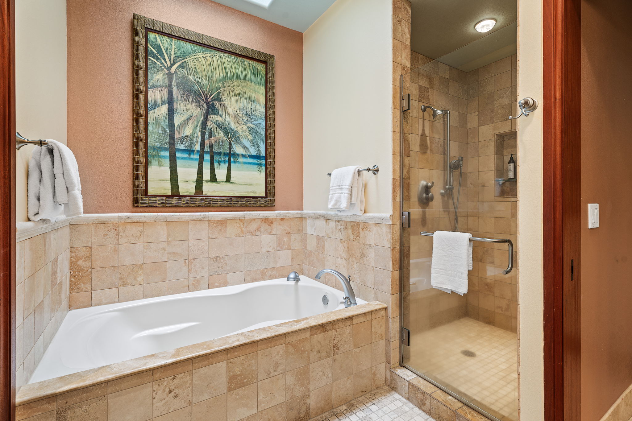 69-1000 Kolea Kai Circle, Unit 16J Waikoloa, HI 96738 - Photo 14 of 25 a bathroom with a bathtub and a shower