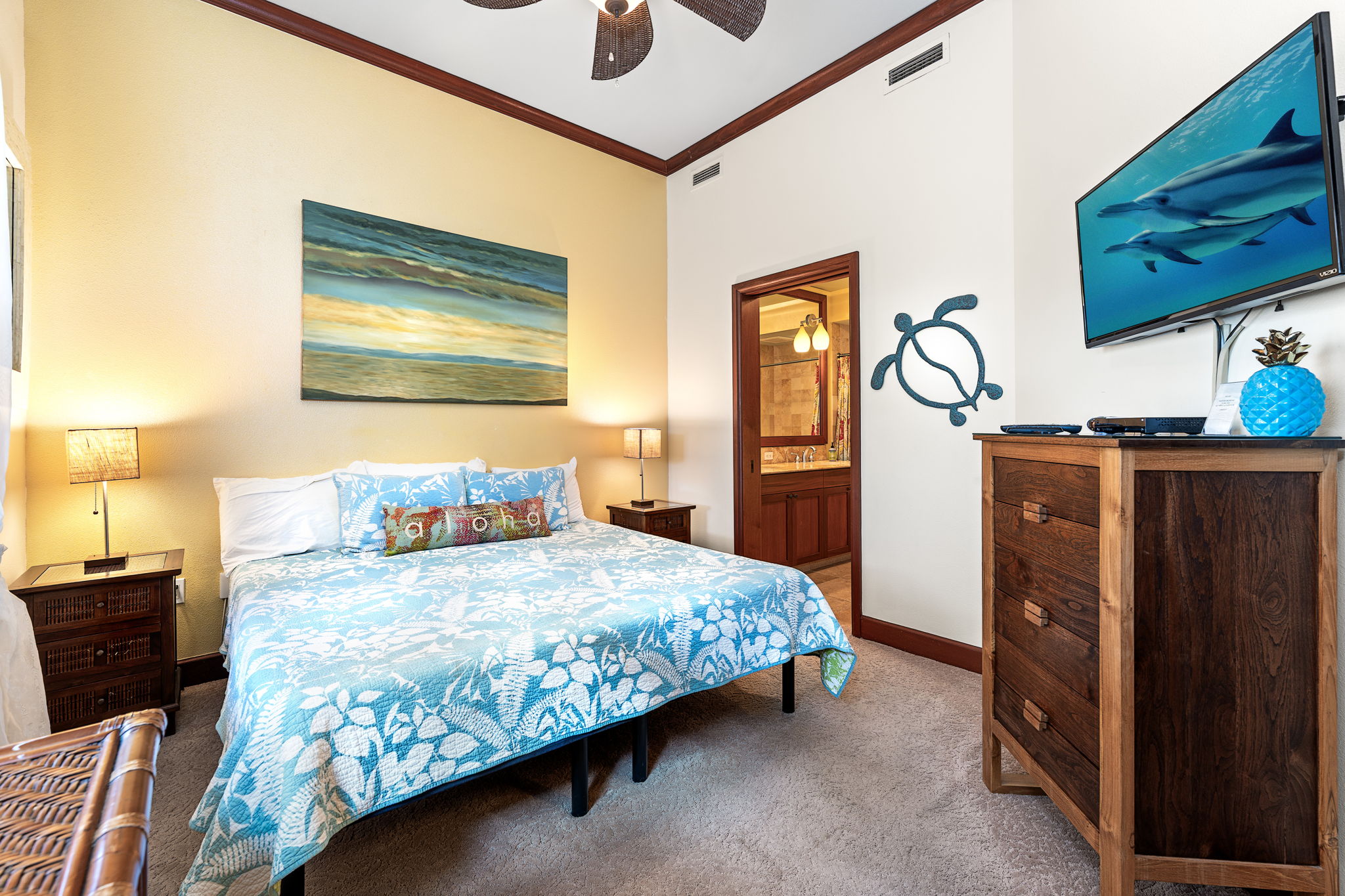 69-1000 Kolea Kai Circle, Unit 16J Waikoloa, HI 96738 - Photo 24 of 25 a bedroom with a bed and wooden floor