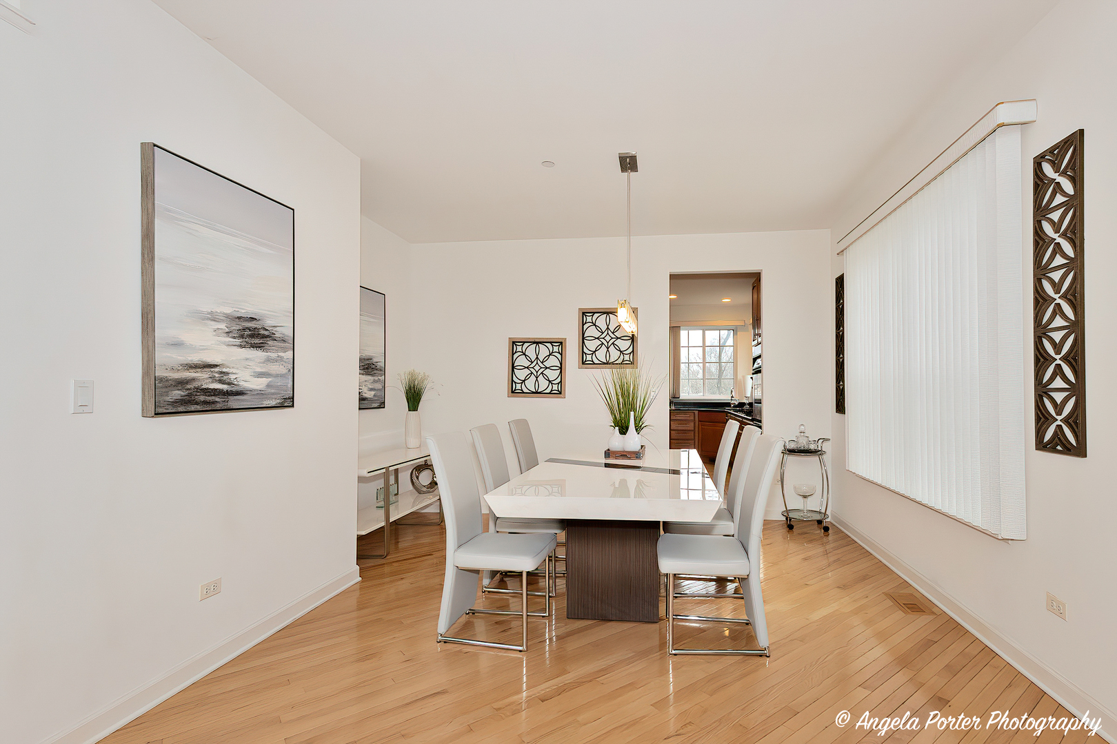 1340 Horizon Trail Wheeling, IL 60090 - Photo 8 of 27 a view of a dining room with furniture and wooden floor