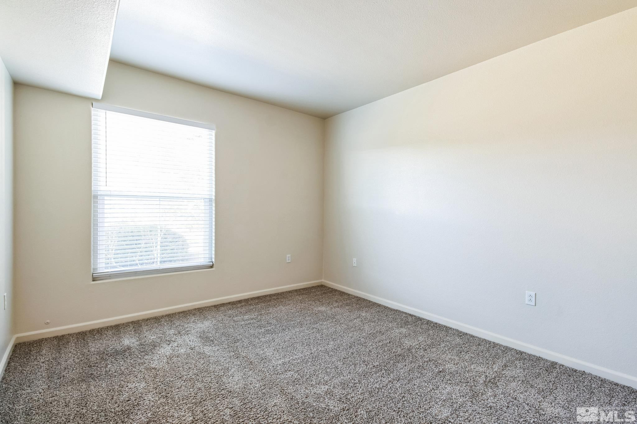 9050 Double R Boulevard, Unit 1412 Reno, NV 89521 - Photo 11 of 18 an empty room with a window