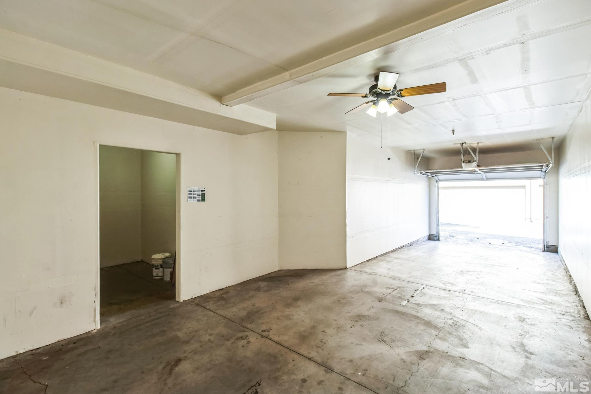 9050 Double R Boulevard, Unit 1412 Reno, NV 89521 - Photo 15 of 18 en empty room with windows and fan