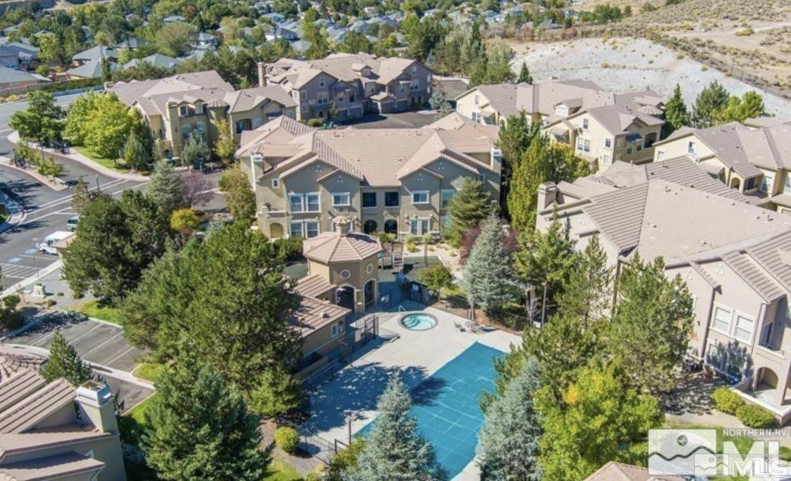 9050 Double R Boulevard, Unit 1412 Reno, NV 89521 - Photo 17 of 18 an aerial view of a house with yard swimming pool and outdoor seating