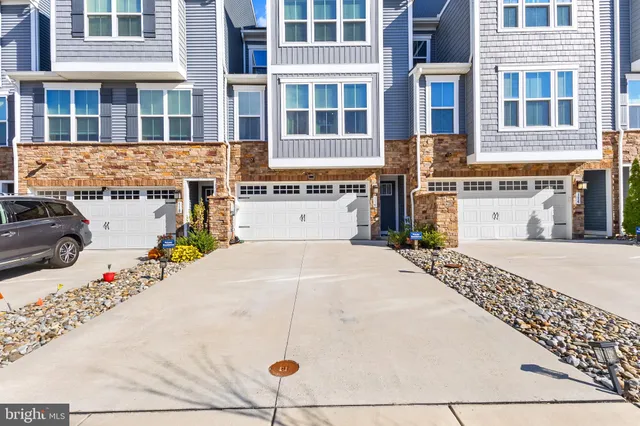 a front view of a building with white umbrellas