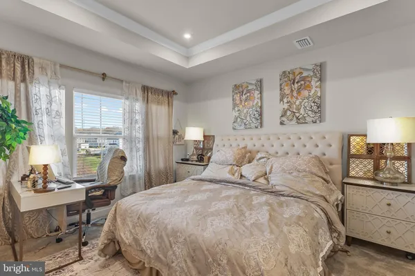 a bedroom with a bed and furniture
