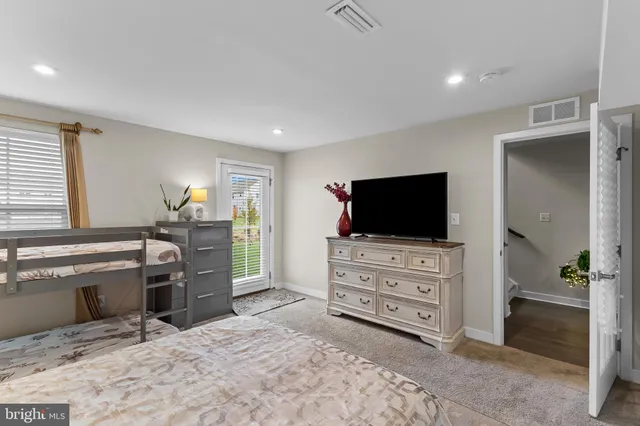 a view of a livingroom with furniture and a flat screen tv