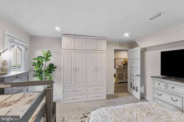 a spacious bathroom with a double vanity sink and a