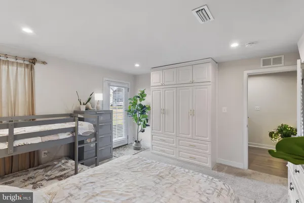 a bedroom with a bed and a table
