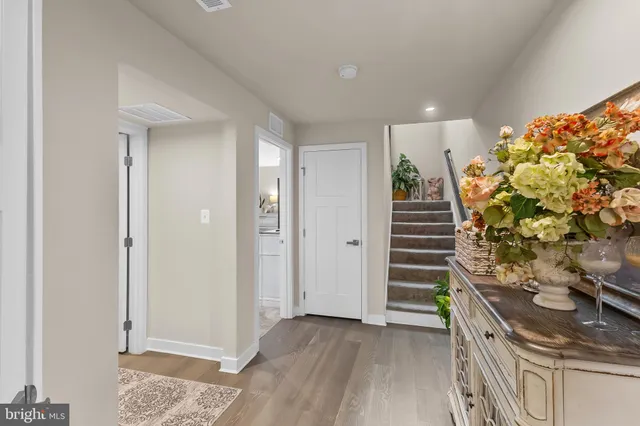 a view of entryway with stairs and furniture
