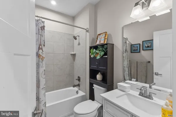 a bathroom with a sink a mirror and a toilet