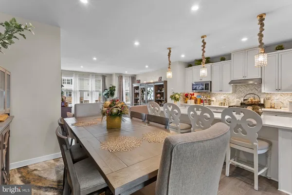 a kitchen with sink a stove and cabinets