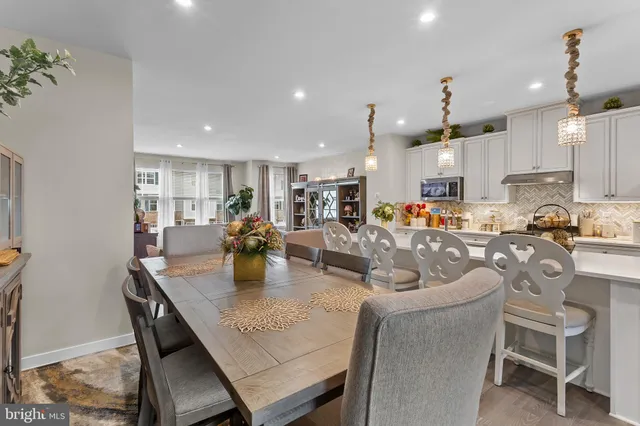a kitchen with sink a stove and cabinets