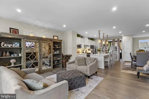 a view of a dining room and livingroom with furniture