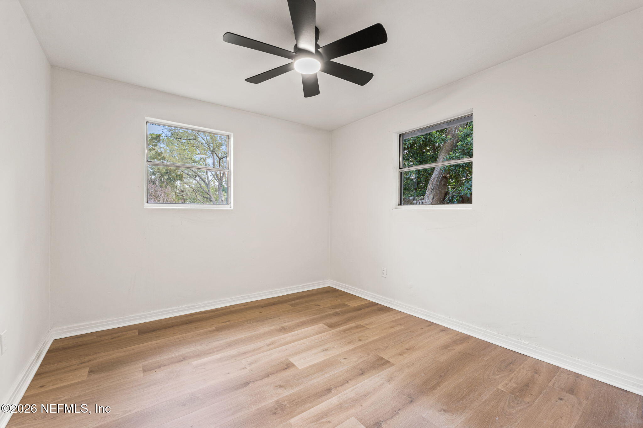 87 Josiah Street St. Augustine, FL 32084 - Photo 13 of 19 an empty room with wooden floor and windows