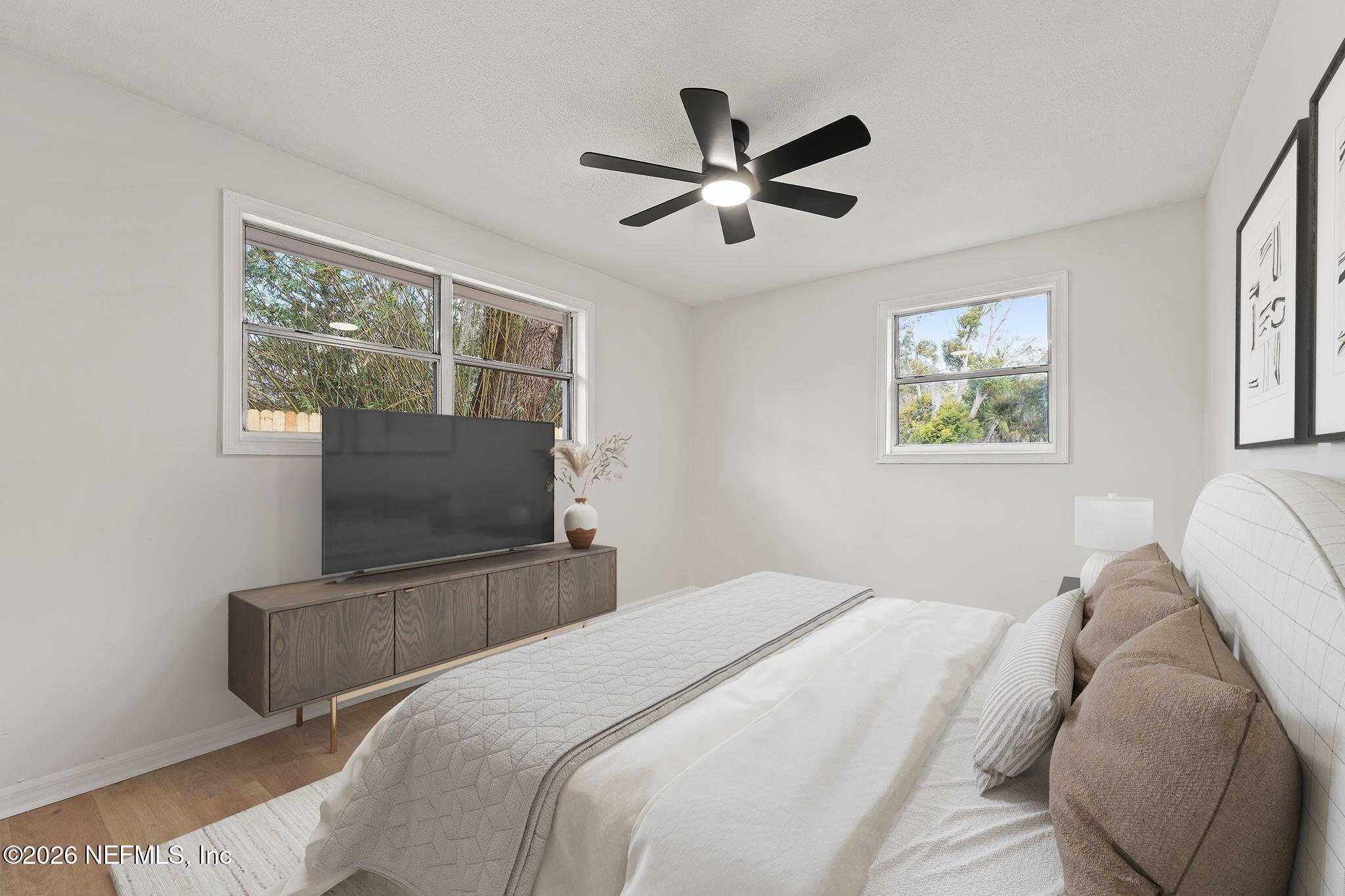 87 Josiah Street St. Augustine, FL 32084 - Photo 14 of 19 a bedroom with a bed and a flat screen tv