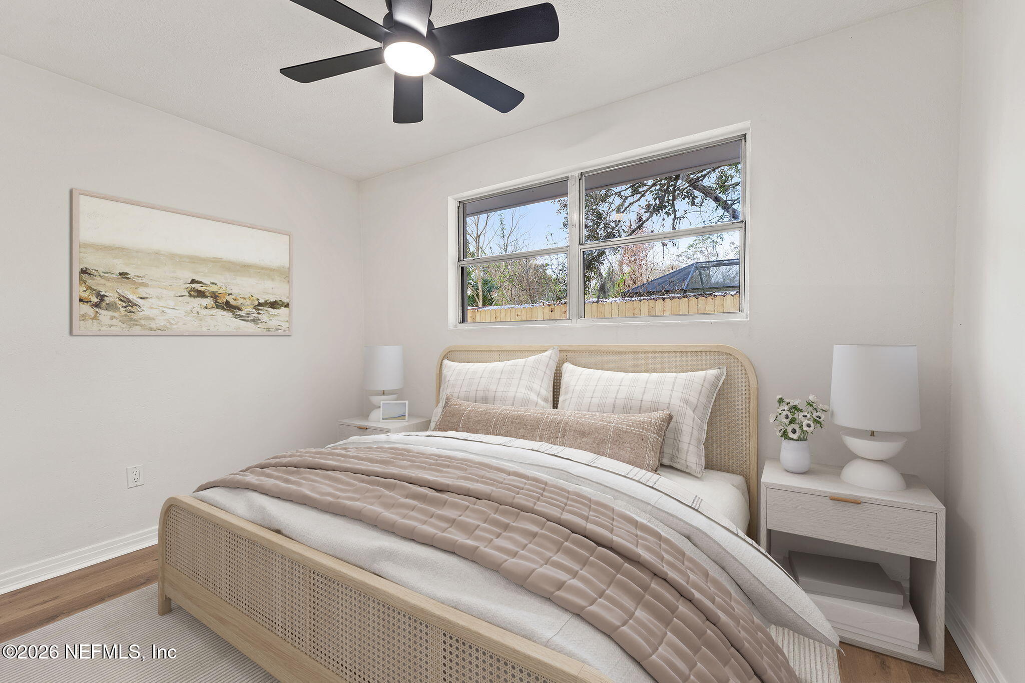 87 Josiah Street St. Augustine, FL 32084 - Photo 16 of 19 a bedroom with a bed and a painting on the wall