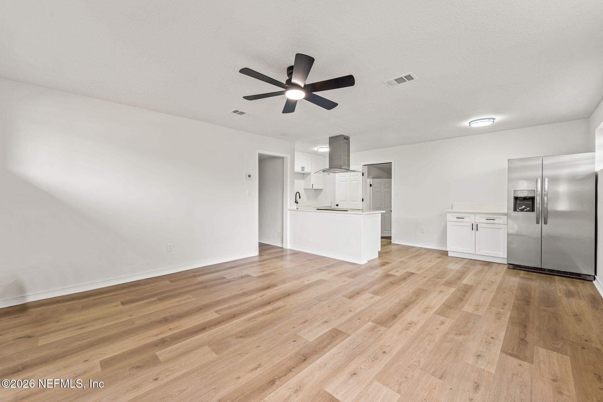 87 Josiah Street St. Augustine, FL 32084 - Photo 4 of 19 a view of a kitchen with a sink and a refrigerator