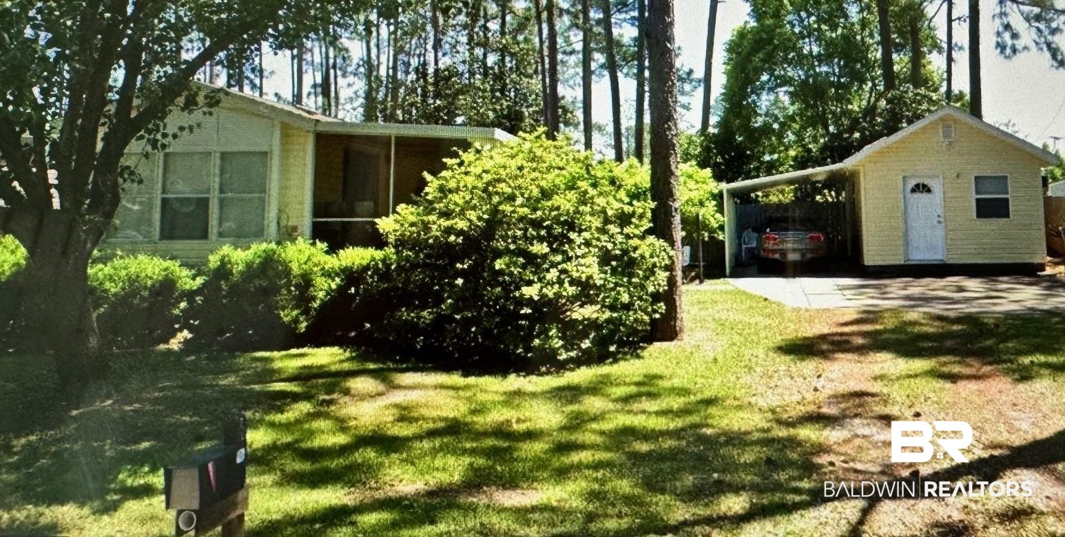 518 Elberta Loop Lillian, AL 36549 - Photo 2 of 38 View of yard with a carport