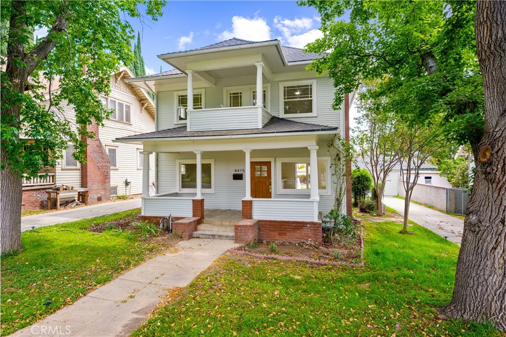 front view of a house with a yard