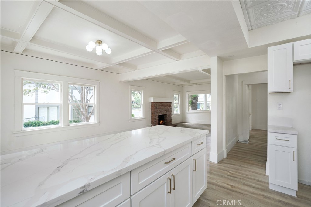 4415 12th Street Riverside, CA 92501 - Photo 11 of 33 a spacious bathroom with a granite countertop sink a mirror and a shower