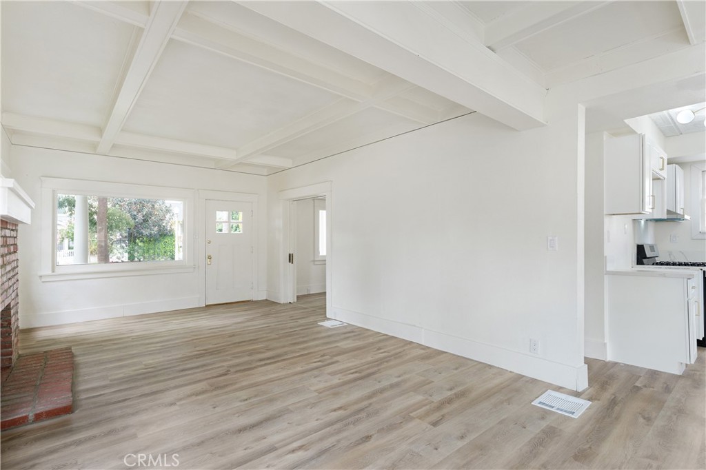 4415 12th Street Riverside, CA 92501 - Photo 16 of 33 an empty room with wooden floor and windows