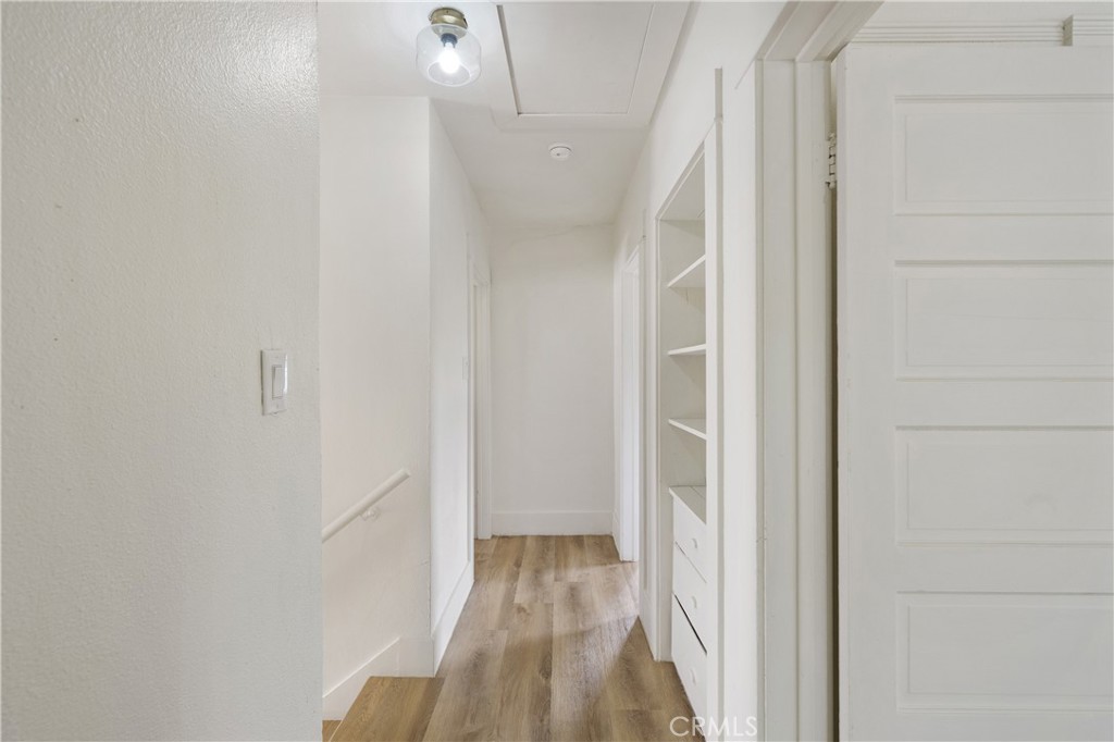 4415 12th Street Riverside, CA 92501 - Photo 18 of 33 a view of a hallway with wooden floor and entryway