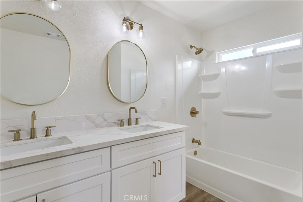 4415 12th Street Riverside, CA 92501 - Photo 29 of 33 a bathroom with a sink and a mirror