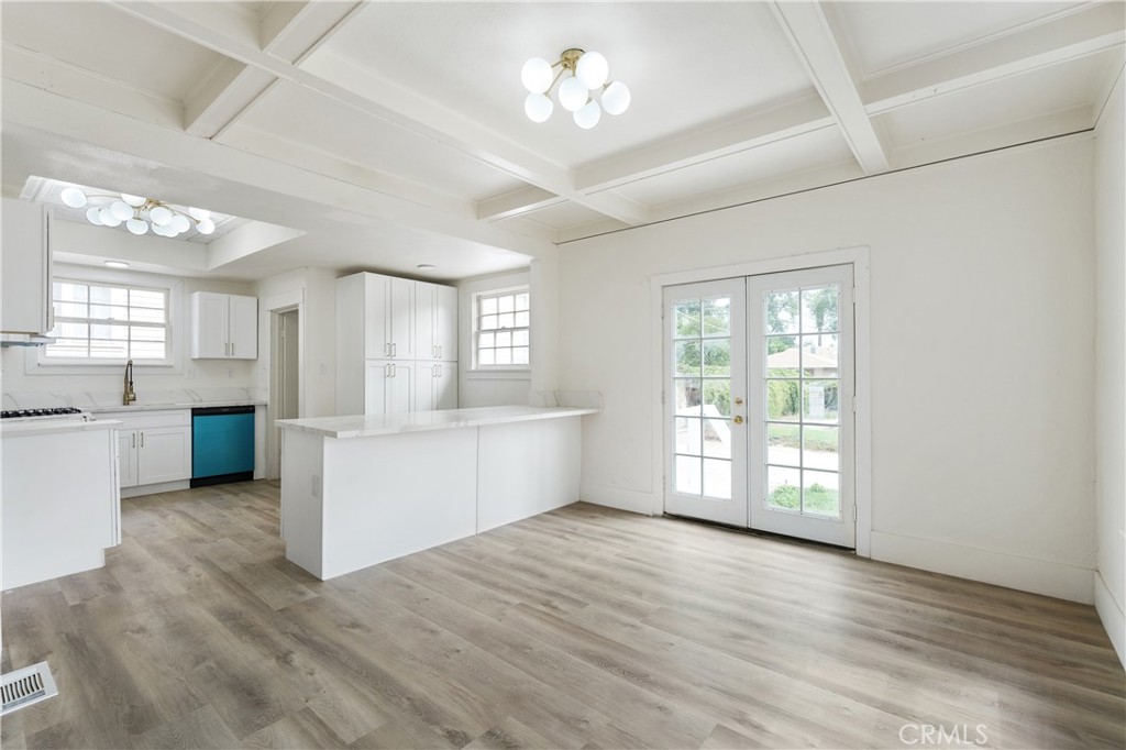 4415 12th Street Riverside, CA 92501 - Photo 10 of 33 a view of an empty room with a window and wooden floor