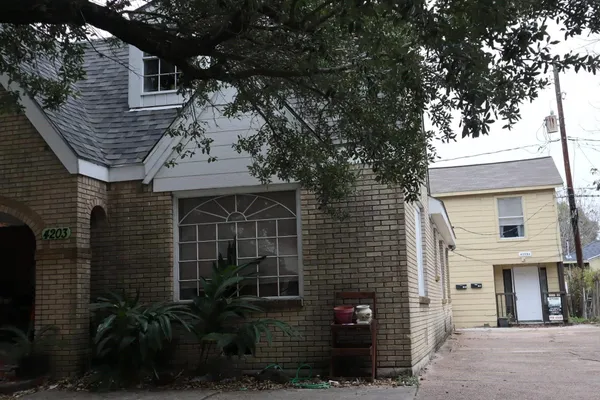 a front view of a house with garage