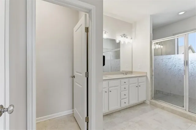 a bathroom with a double vanity sink and a mirror