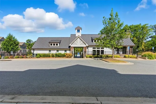 a view of house with a swimming pool