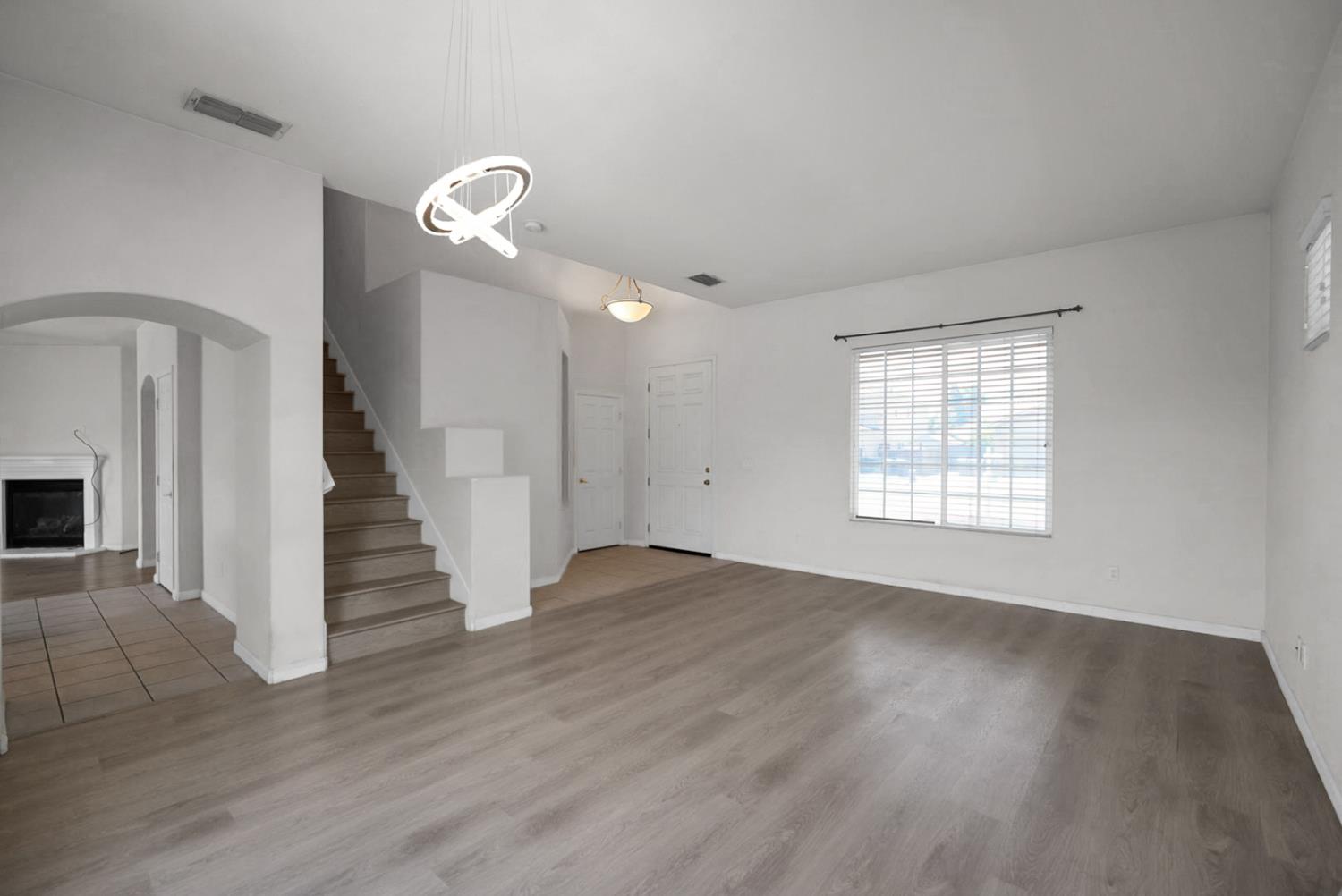 1412 Red Ribbons Lane Manteca, CA 95337 - Photo 6 of 32 wooden floor in an empty room with a window
