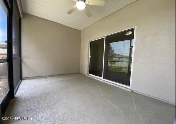 an empty room with fan