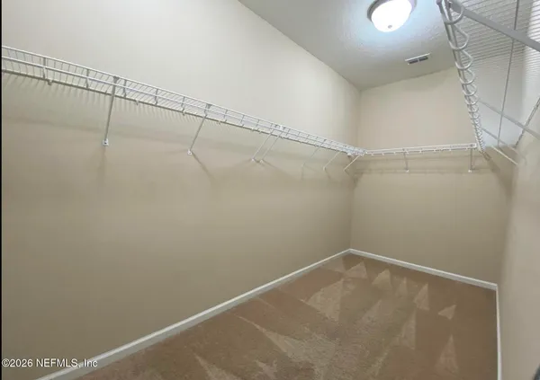 a view of a room with racks on the wall